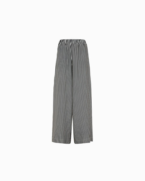 Pantaloni nero-beige con eleganti contrasti