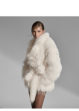 Veste courte en fourrure synthétique crème