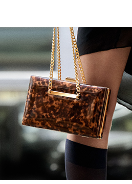 Clutch leopardata in vernice
